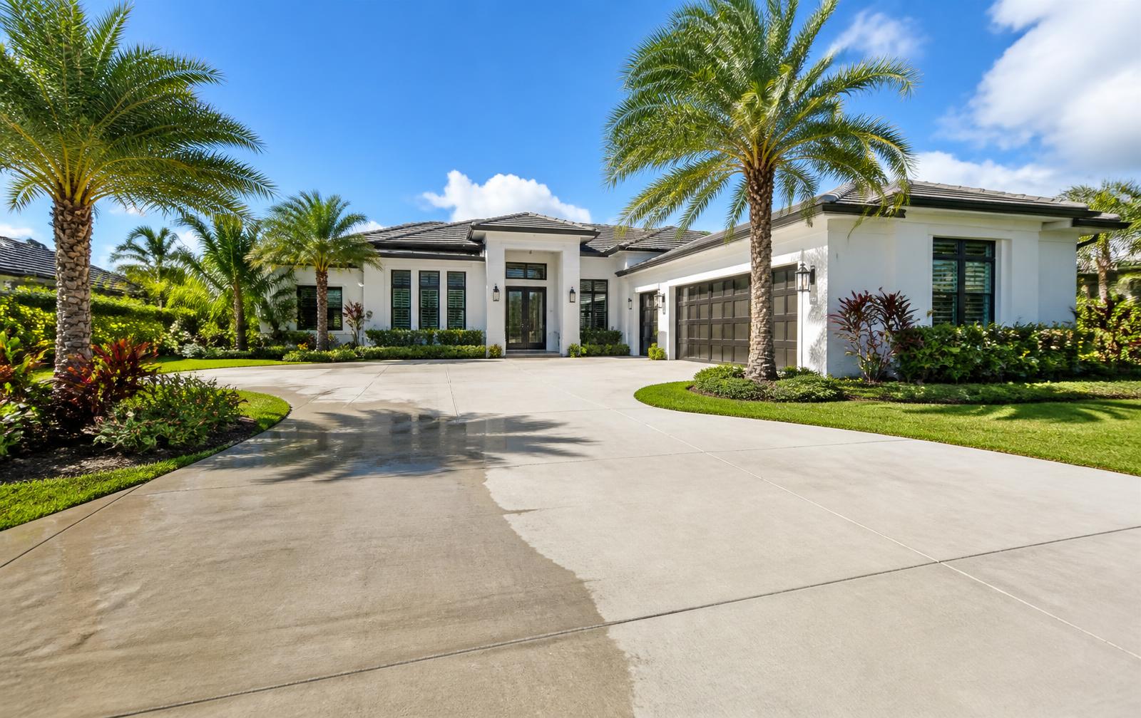 Freshly pressure-washed driveway in front of a South Florida home